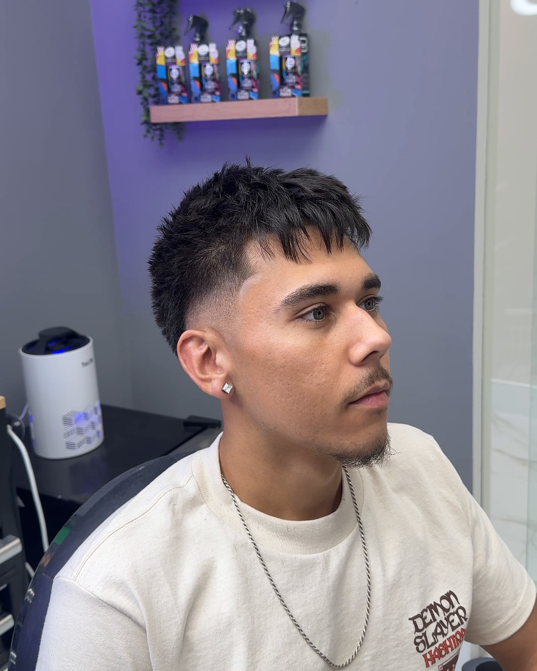 Textured crop with a mid taper fade by Cuts By Cello